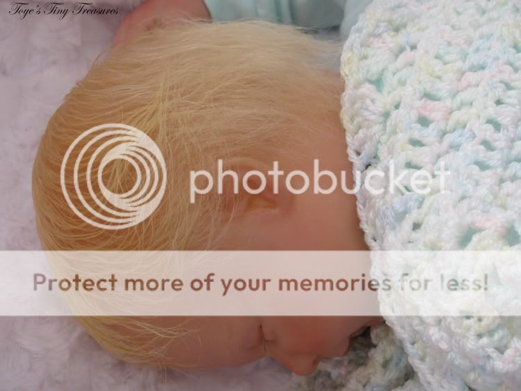 Hannah’s limbs have been weighted with tiny glass beads and ‘Eversoft’ polyester stuffing. I